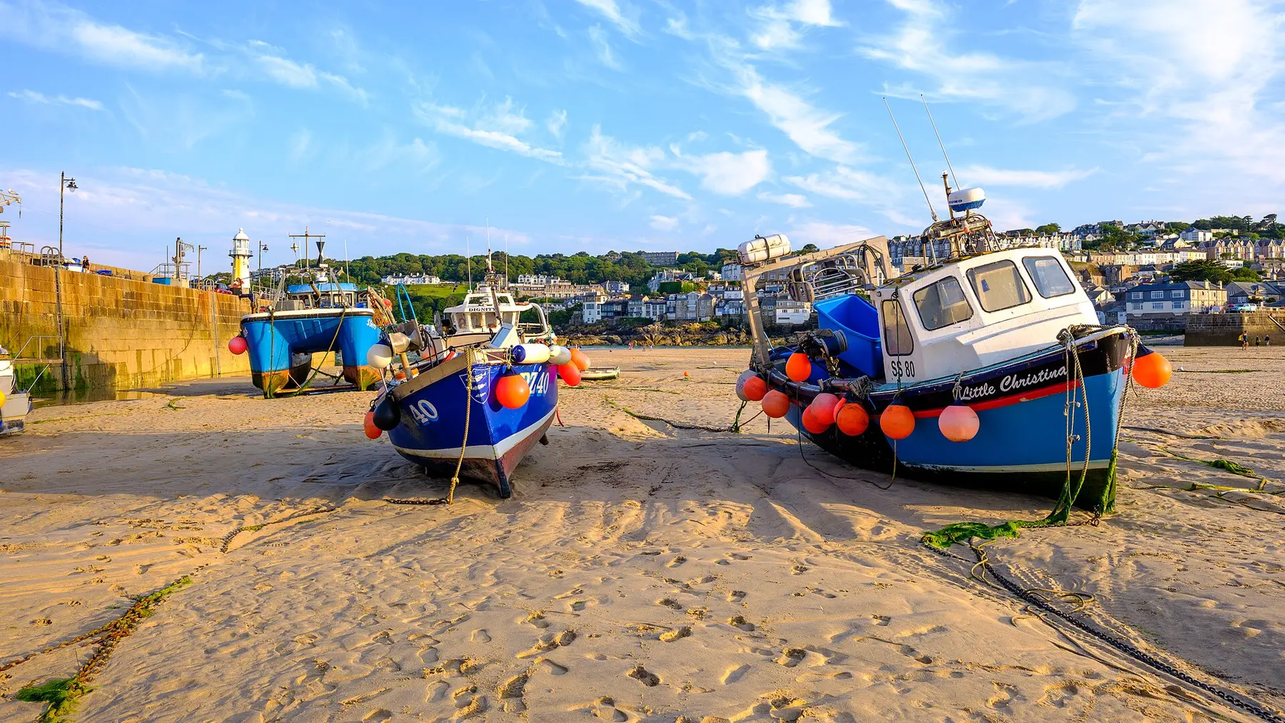 Fishing boats on the sand at St Ives harbour, Cornwall